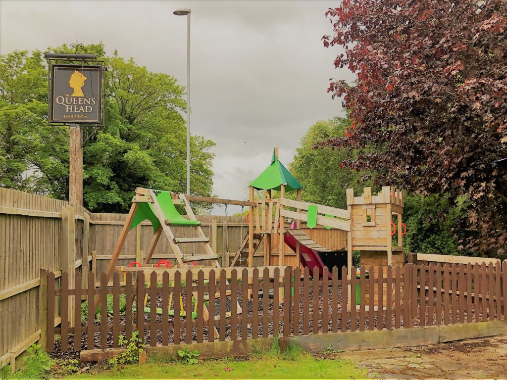 Pub garden with children's play area at the Queens Head Harston Cambridgeshire