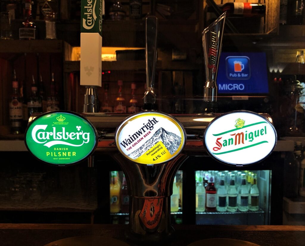 Carlsberg Wainwright and San Miguel beer font at the Queens Head Harston Cambridgeshire